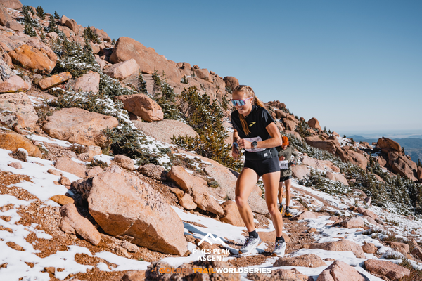 Anna Gibson running up a mountain
