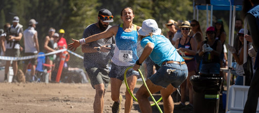 runner getting cooled down with a garden hose