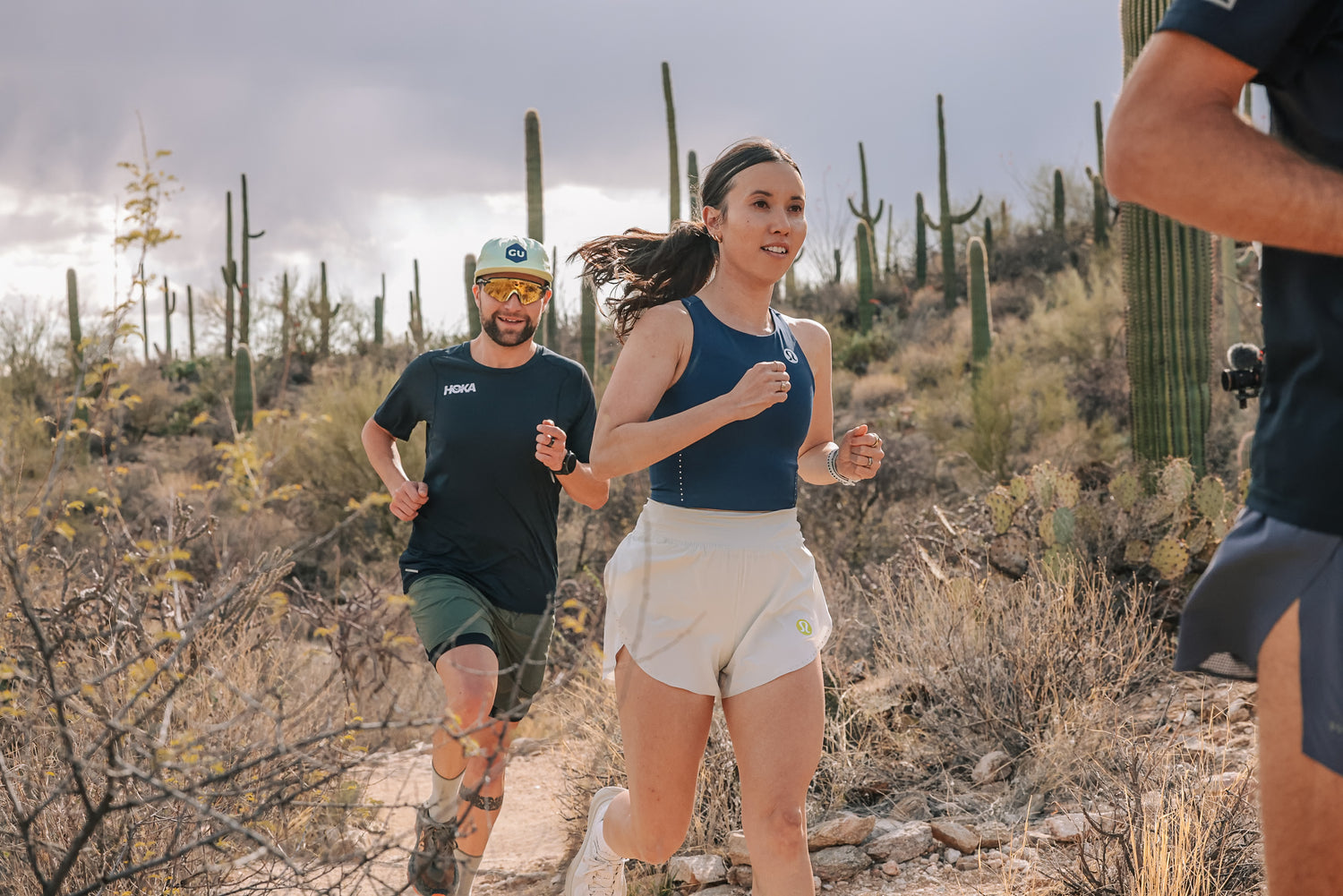 runners on desert trail