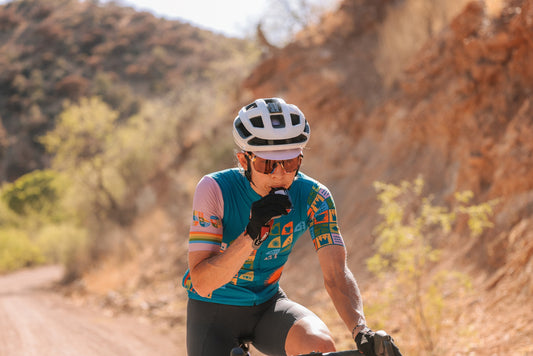 Gravel rider eating a gel