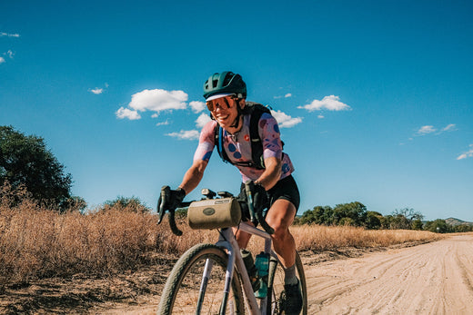 Serena riding her gravel bike in the desert.